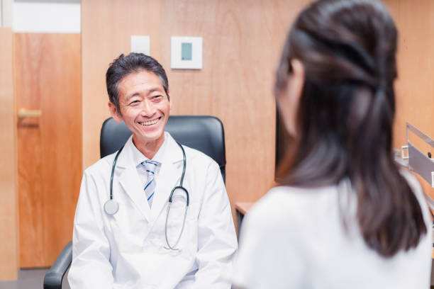 Family doctor examining a woman